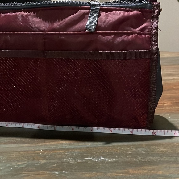 Travel maroon toiletry bag. 10” long by 6” tall. - Picture 8 of 9